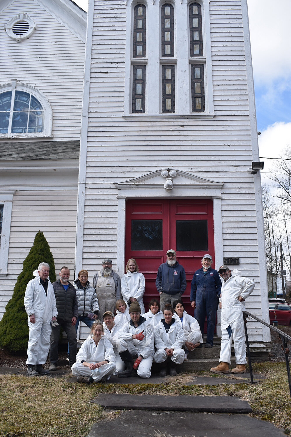 Fifteen of the 20 volunteers who donned hazmat suits and cleaned out the basement of the Presbyterian Church in New Kingston to make way for a Community Center, Saturday, March 16.